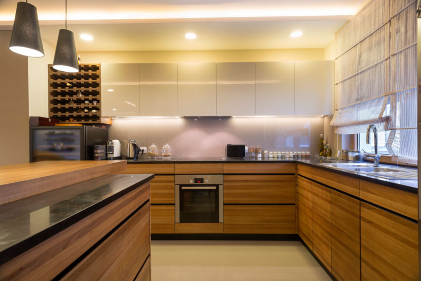 Kitchen with floating base cabinets, countertops, and pendant lights