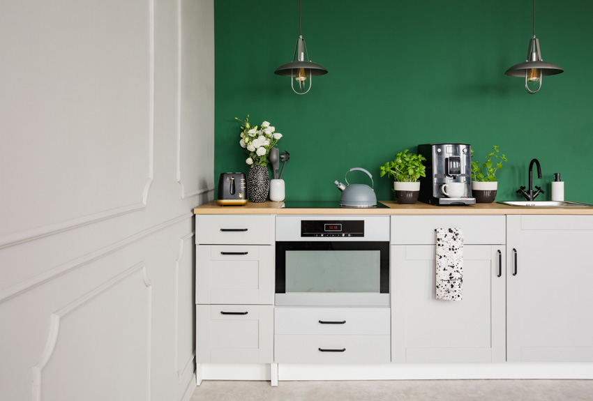 Kitchen with green painted wall