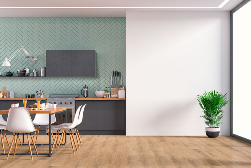 Kitchen with aqua herringbone tile