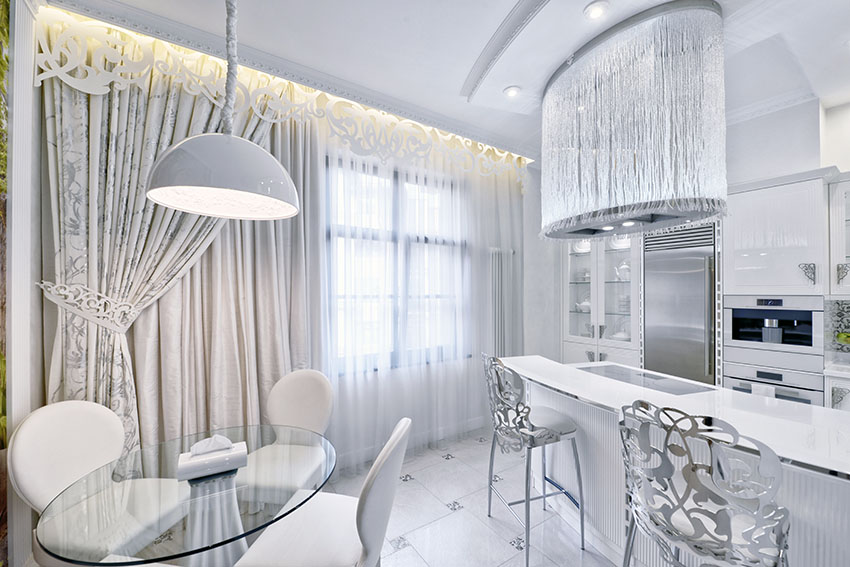 Kitchen with royal style curtains white cabinets