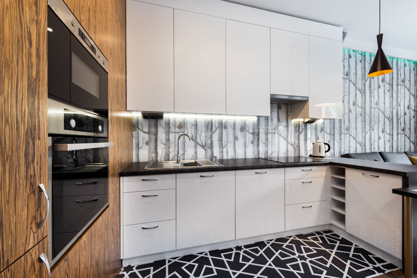 Kitchen with wallpaper and strip light on wall