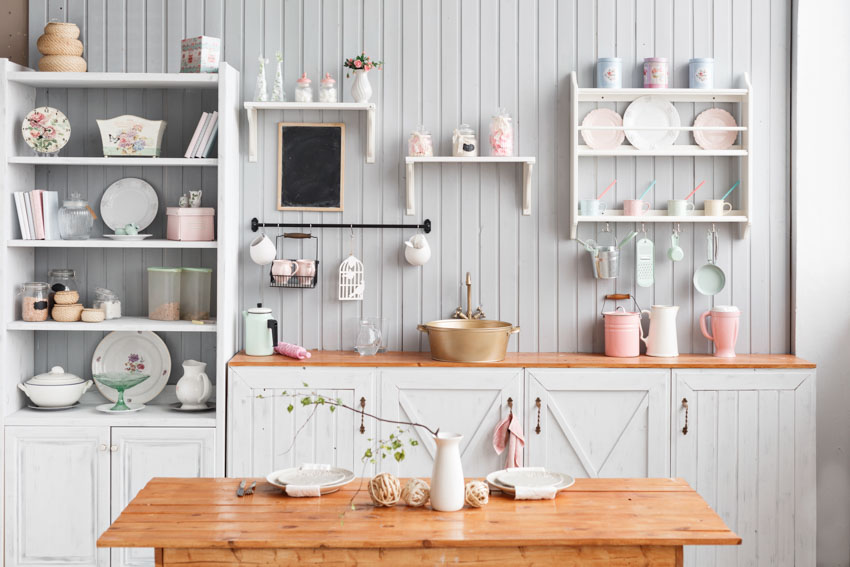 White beadboard wall and open shelving