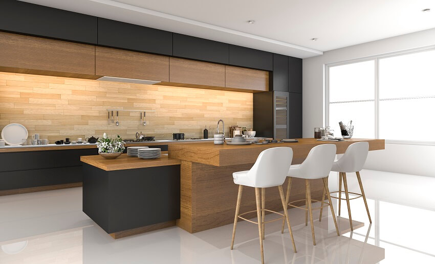 Large modern design with wood backsplash and wood island with counter and barstools