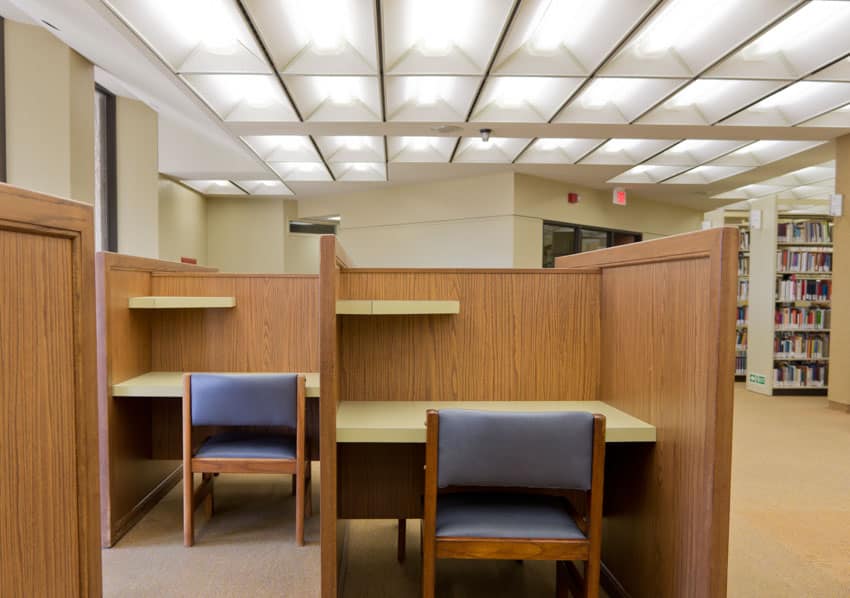 Library space with carrel desks, and chairs