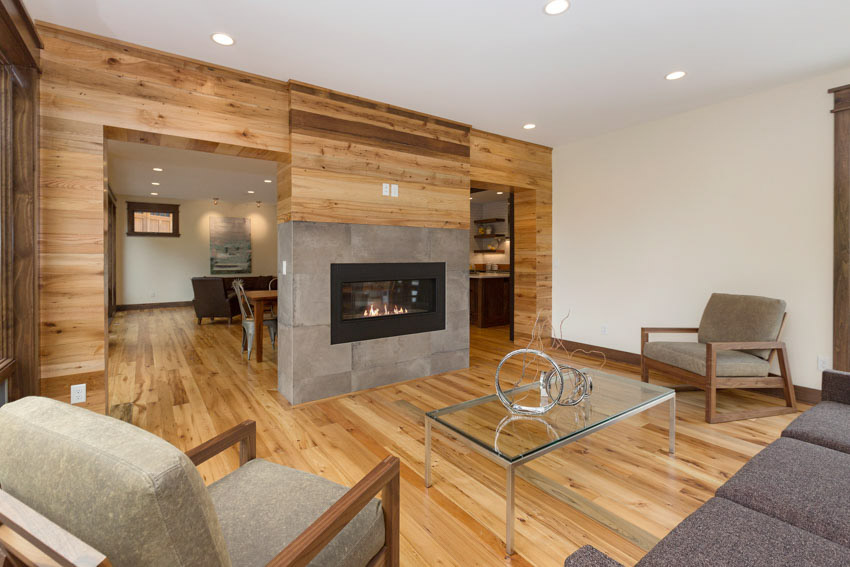 room with wood wall fireplace and tile cladding