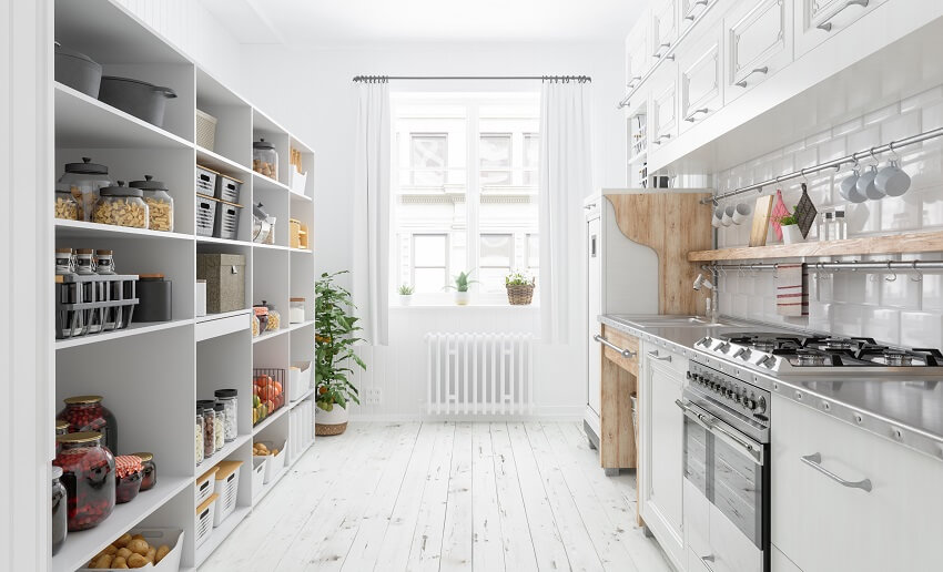 Modern kitchen interior with subway tile backsplash, wood floor, white cabinets, and organised pantry