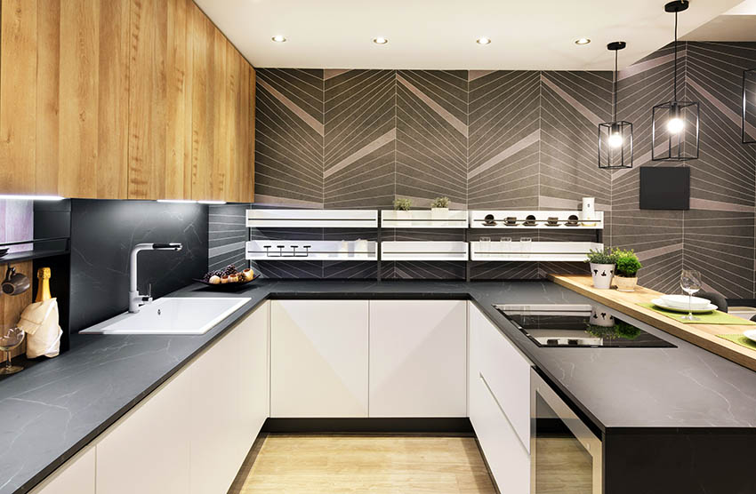 Modern design and black soapstone countertops and black geometric shape wall