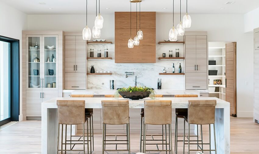Modern kitchen with floating shelves, laminate cabinets, pendant lights, and island with stools