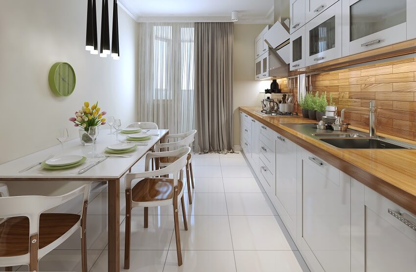 Narrow kitchen and dining area with floor-to-ceiling curtains