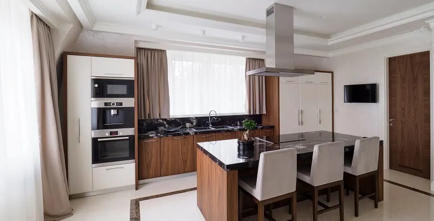Neutral toned kitchen with café curtains