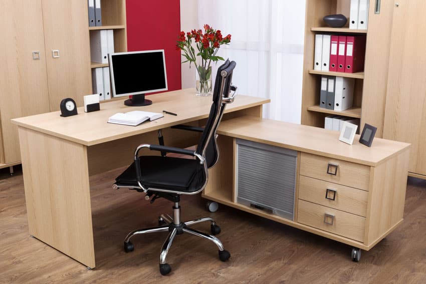 Office space with desk, pedenza, chair, computer, and wood floor