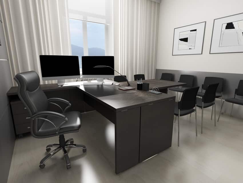 Peninsula desk and black chairs