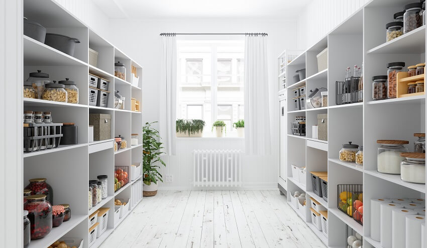 Organized white U shaped pantry with plants by the windows, beadboard walls, and wood floor