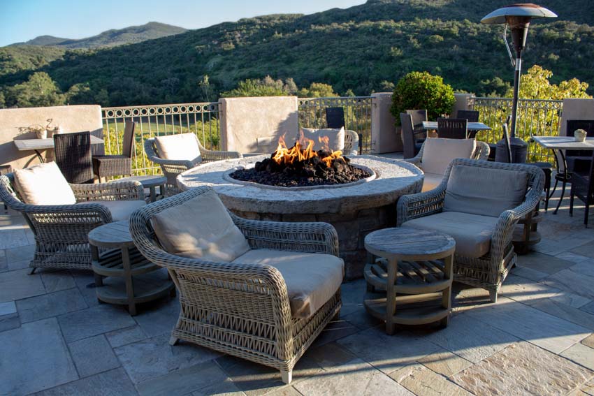 Outdoor area with chairs and fire pit table