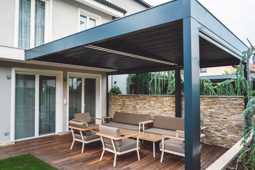 Outdoor area with pergola, coffee table, chairs, and wood deck