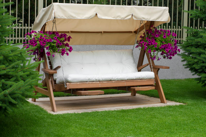 Outdoor swinging sofa with cushion in an outdoor area