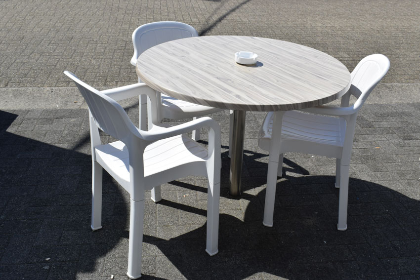 Plastic chairs and tables for outdoor areas