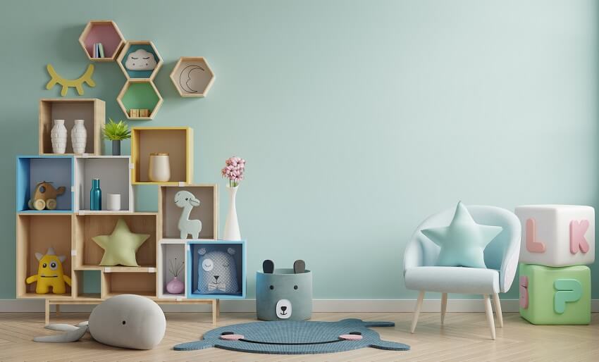 Playroom with parquet floor, wood cubby storage, and hexagon floating shelves mounted on light blue wall