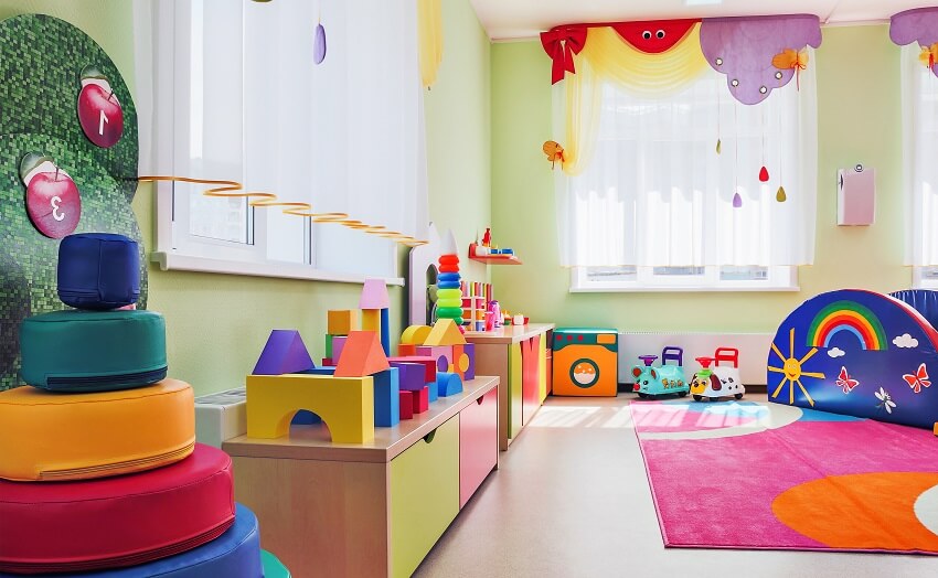 Playroom with colorful carpet and sheer curtains