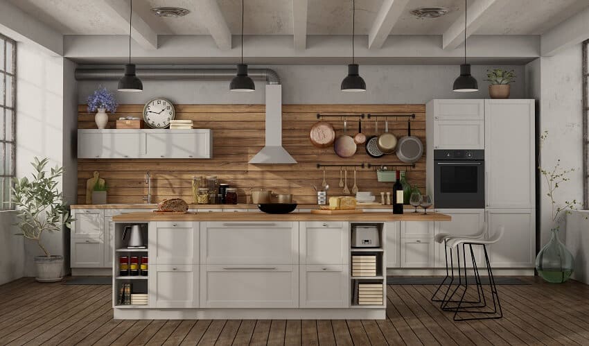 Retro white kitchen with pendant lights, wood countertops, ceiling beams, and horizontal beadboard backsplash