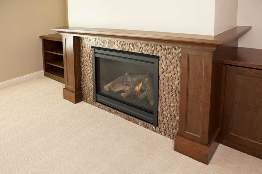 Simple fireplace with mosaic tiling