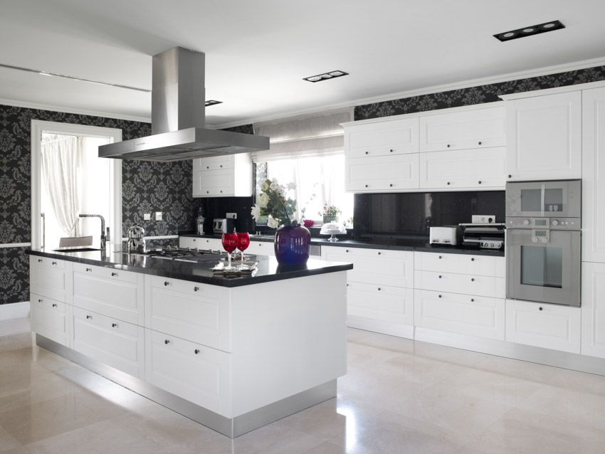 Spacious kitchen with ceramic flooring, black and gray fabric wall