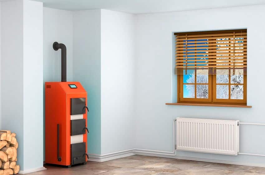 Furnace in a room with logs, wall heater, and window