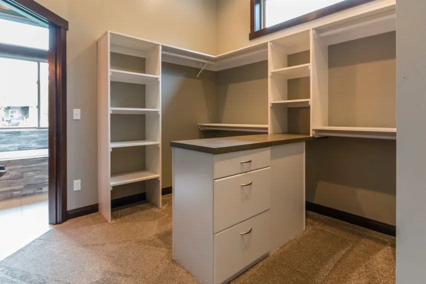 Narrow closet with several levels of open shelves