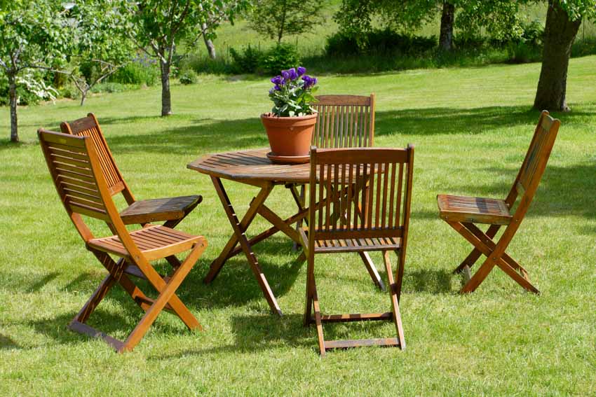 Wooden chairs and table for outdoor areas