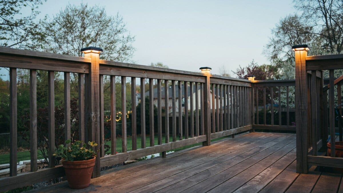 Deck fence with post cap lights on the railing posts
