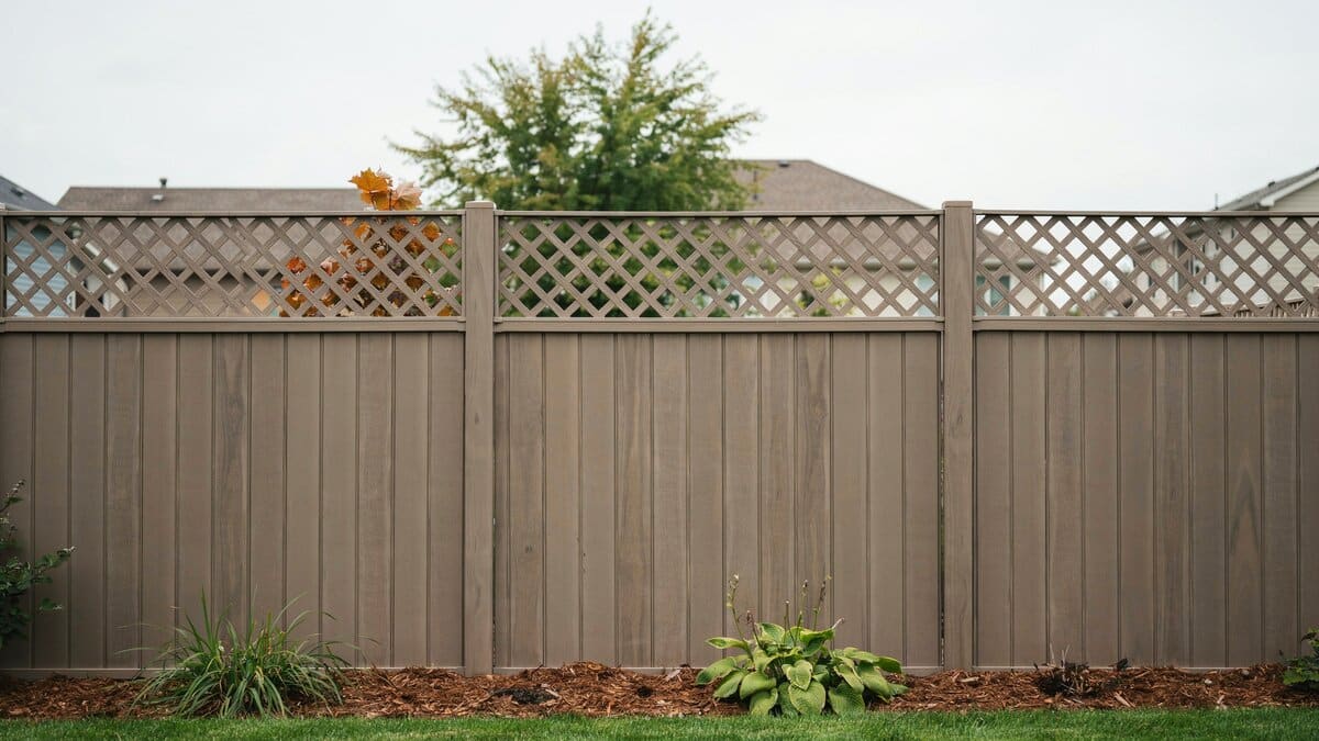 Composite panel fence topped with a lattice section