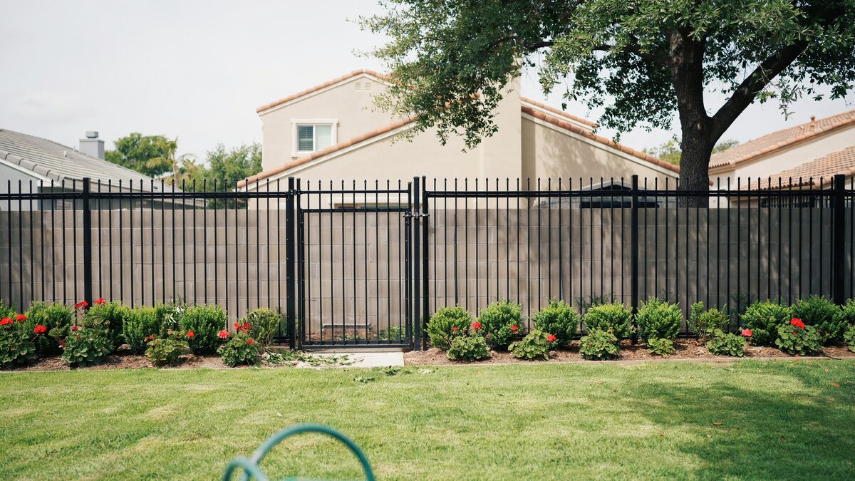 Black aluminum fence around a residential yard