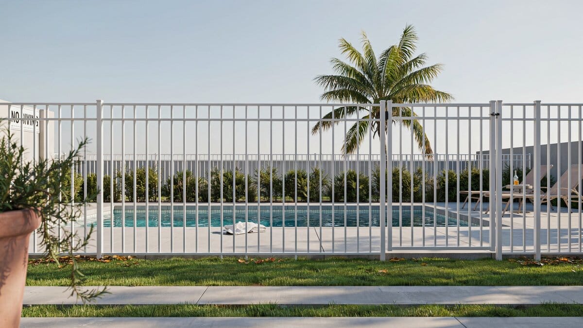White metal bar security fence around a swimming pool