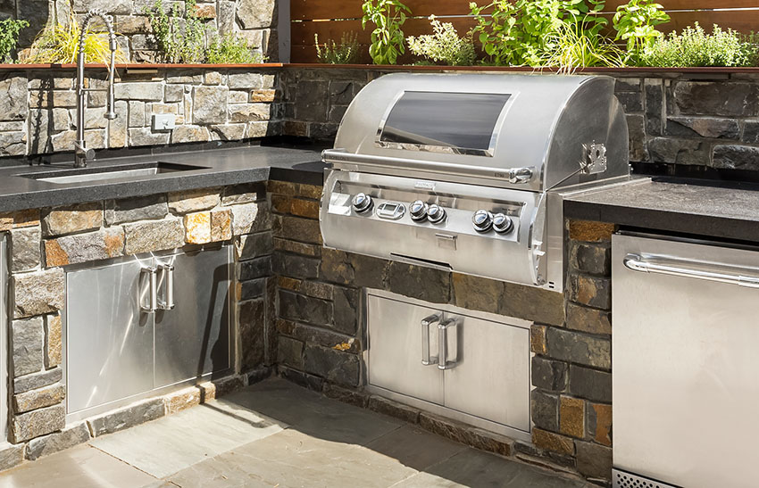 Outdoor kitchen with built-in stainless grill