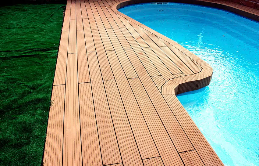 Swimming pool with composite decking