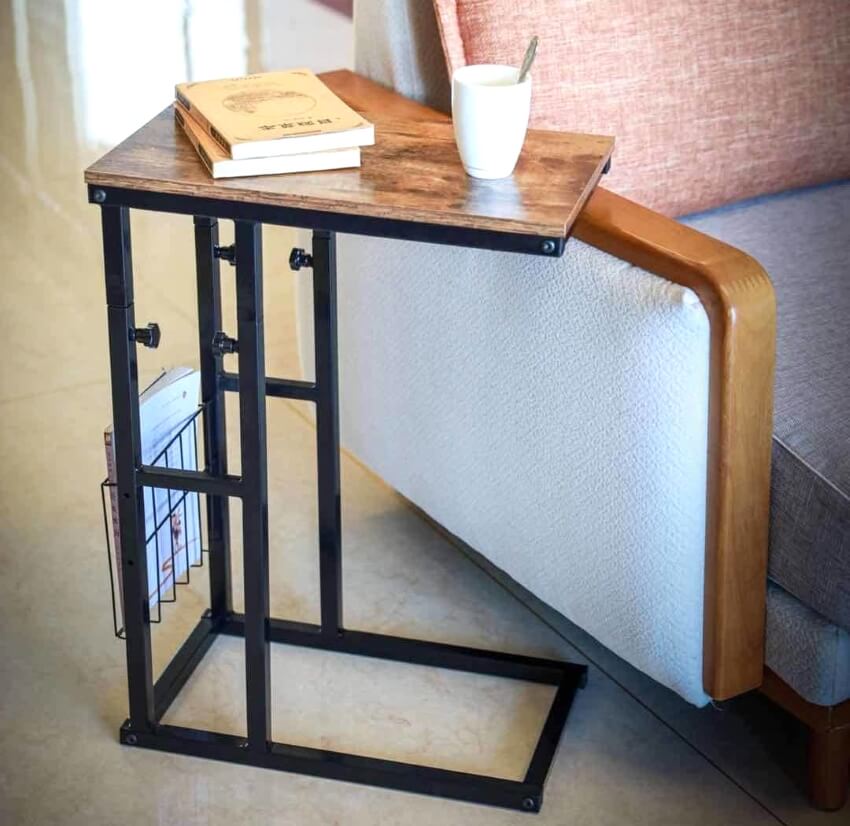Adjustable height c-style table with cup and books on wood top
