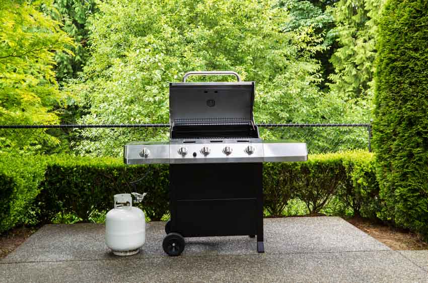 Backyard area with propane griller, and tank