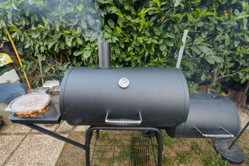 Backyard barbecue with pros and cons of pellet grills for cooking food