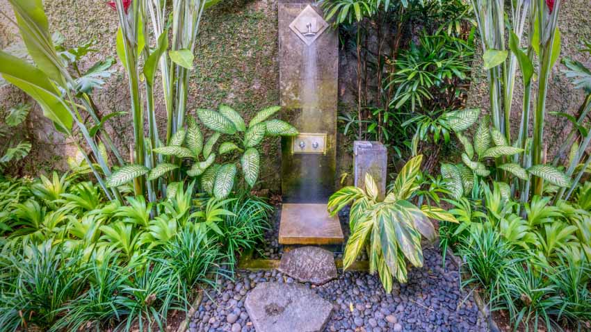 Shower in the middle of a tropical garden