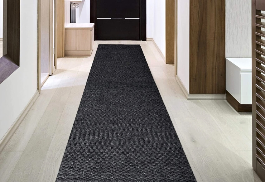 Black loop carpet runner in hallway