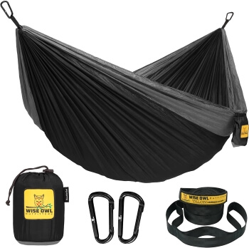 Black portable camping hammock with accessories and tree straps