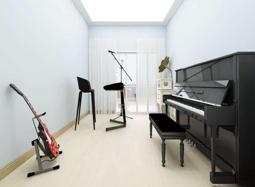 Bright music room with guitar and black studio piano