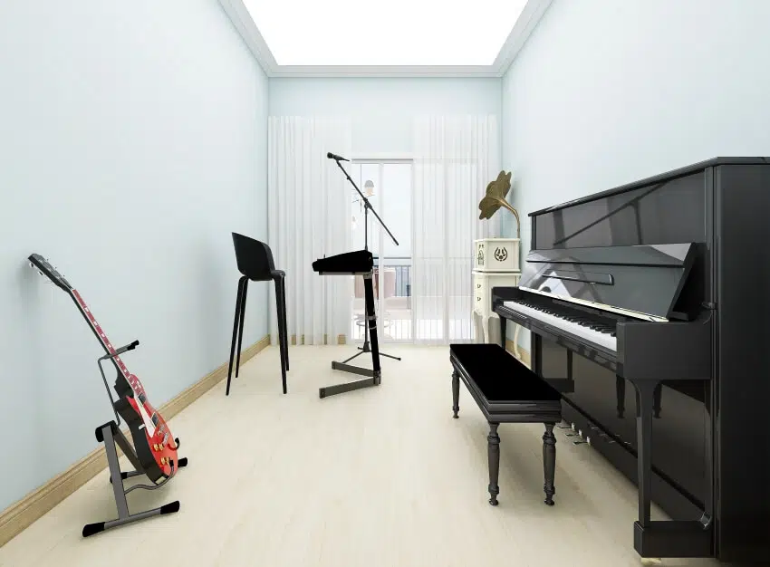 Bright music room with guitar and black studio piano 