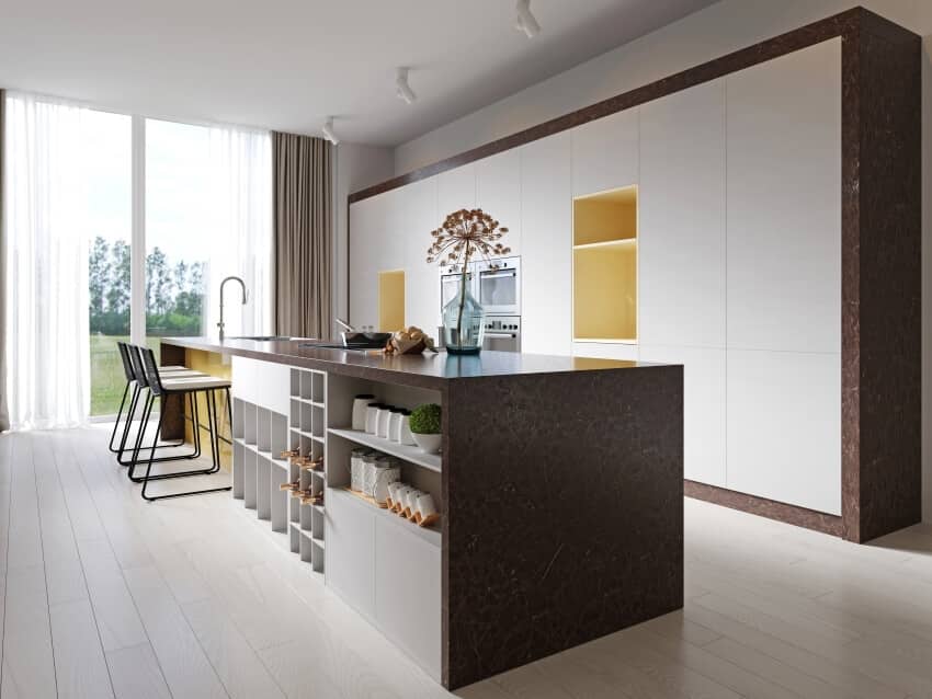 Contemporary kitchen with panel floor, white cabinets, and a large island with brown granite countertop