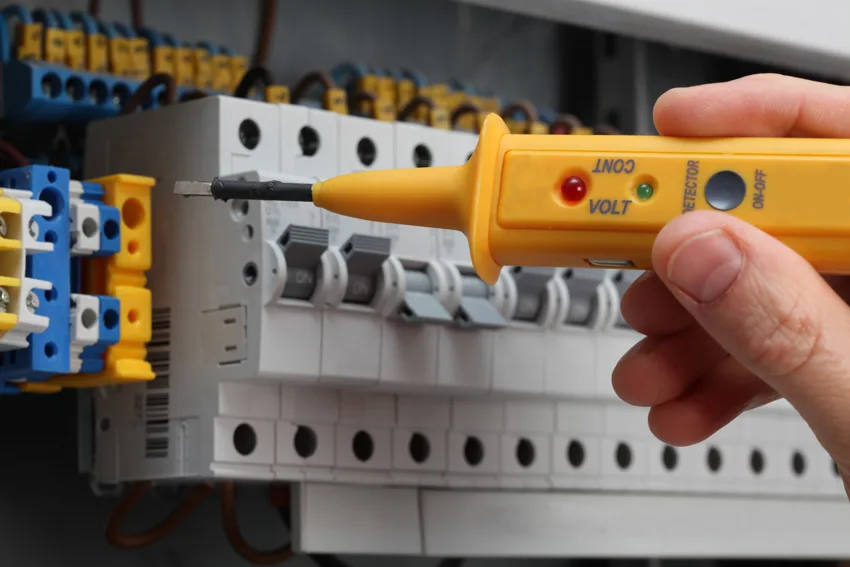 Contractor maintaining surge protector for whole houses