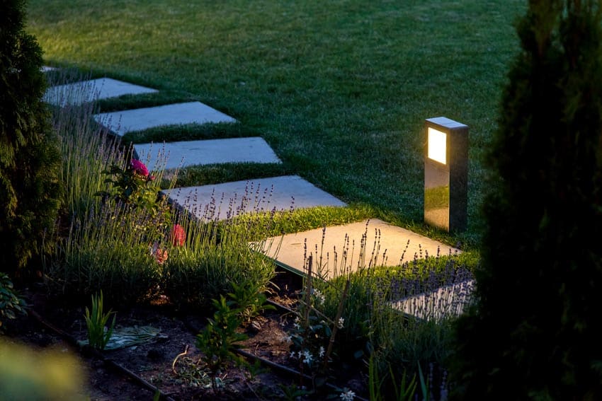 Garden pathway with outdoor lighting fixtures