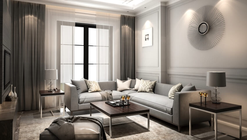 Grey living room interior with wall decors, floor to ceiling curtains, and matching coffee and end table