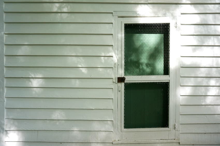 House exterior with screen door, and white siding