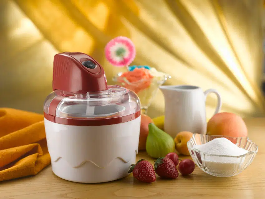 Ice cream maker with fruits and sugar