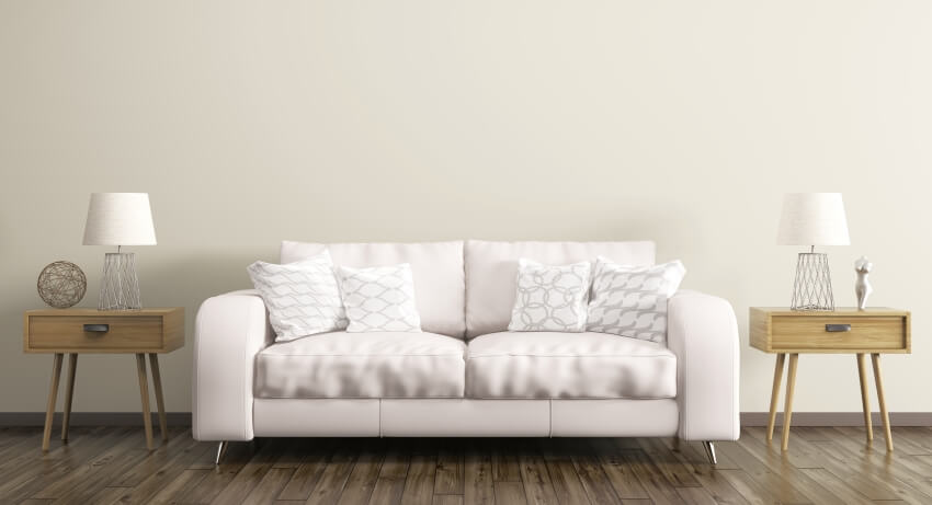 Room with sofa, and two rectangle-shaped wooden sofa tables